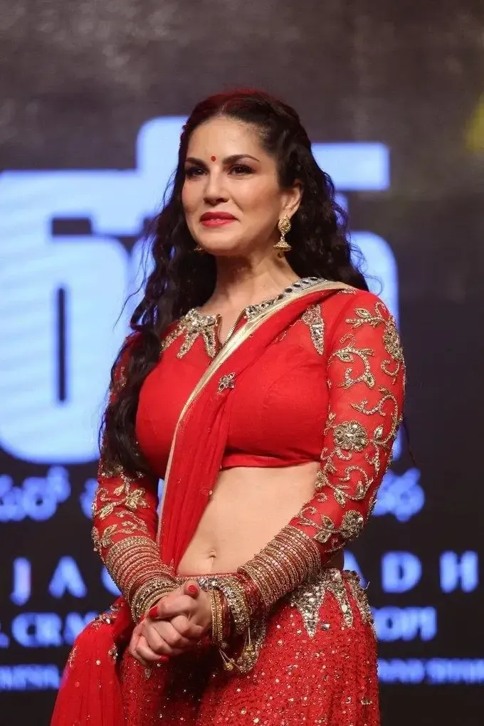 SUNNY LEONE IMAGES IN RED SAREE AT TELUGU MOVIE AUDIO LAUNCH 3